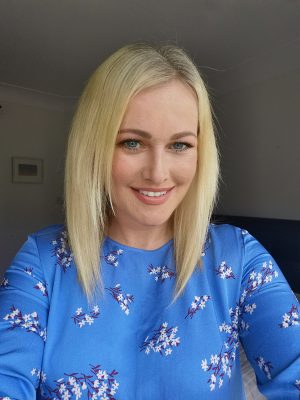 Lorna Weightman wearing a blue dress with flowers