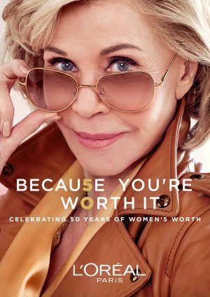 Jane Fonda wearing sunglasses and a light brown coat in a L'Oreal Paris advert