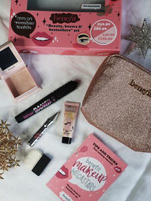 Christmas beauty gift set from Benefit containing make up products on a table