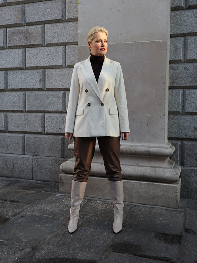 Lorna weightman pictured wearing cream jacket, leather trousers and cream boots 