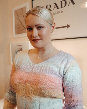 Image of Lorna Weightman front of a gallery wall